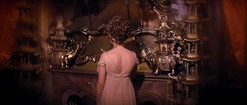 Movie still from “On a Clear Day You Can See Forever” (1970), directed by Vincente Minnelli – A young girl in a dress looking into a mirror; Medium shot, High angle