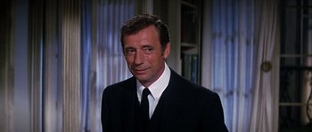 Movie still from “On a Clear Day You Can See Forever” (1970), directed by Vincente Minnelli – A person wearing a suit and tie; Close Up shot, Low angle