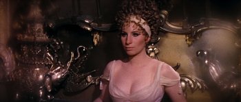 Movie still from “On a Clear Day You Can See Forever” (1970), directed by Vincente Minnelli – A woman in a white dress and a white headband; Close Up shot, High angle
