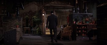 Movie still from “On a Clear Day You Can See Forever” (1970), directed by Vincente Minnelli – A man in a suit walking down a street; Wide shot, High angle