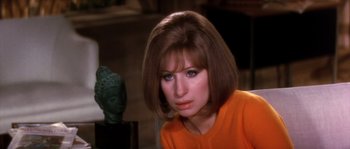 Movie still from “On a Clear Day You Can See Forever” (1970), directed by Vincente Minnelli – A person wearing an orange shirt; Close Up shot, Over the shoulder angle