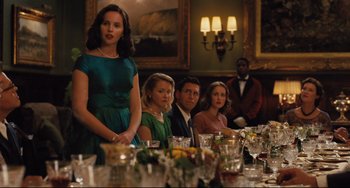Movie still from “On the Basis of Sex” (2018), directed by Mimi Leder – A group of people sitting at a dinner table; Medium shot, Over the shoulder angle