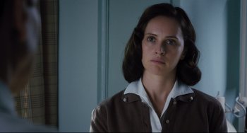 Movie still from “On the Basis of Sex” (2018), directed by Mimi Leder – A person wearing a brown jacket; Close Up shot, Low angle