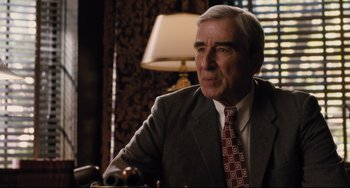 Movie still from “On the Basis of Sex” (2018), directed by Mimi Leder – An older man wearing a suit and tie; Close Up shot, Over the shoulder angle