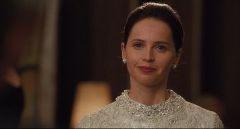 Movie still from “On the Basis of Sex” (2018), directed by Mimi Leder – A person wearing a white dress; Close Up shot, Over the shoulder angle