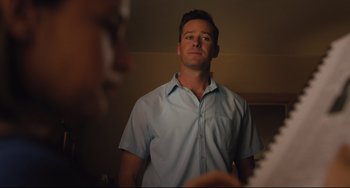 Movie still from “On the Basis of Sex” (2018), directed by Mimi Leder – A man standing in front of a mirror looking at himself in the mirror; Medium shot, Low angle