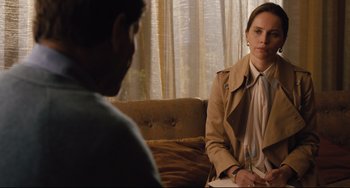 Movie still from “On the Basis of Sex” (2018), directed by Mimi Leder – A man and a woman are sitting on a couch; Medium shot, Over the shoulder angle