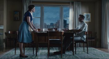 Movie still from “On the Basis of Sex” (2018), directed by Mimi Leder – A man and a woman sitting at a dining room table; Wide shot, Low angle