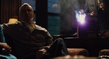 Movie still from “On the Basis of Sex” (2018), directed by Mimi Leder – An older man sitting on a couch next to an open window; Medium shot, Low angle