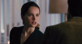 Movie still from “On the Basis of Sex” (2018), directed by Mimi Leder – A person sitting in front of another person; Close Up shot, Over the shoulder angle