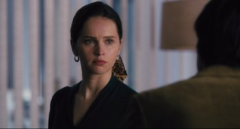Movie still from “On the Basis of Sex” (2018), directed by Mimi Leder – A person wearing a leopard print earring; Close Up shot, Over the shoulder angle