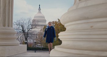 Movie still from “On the Basis of Sex” (2018), directed by Mimi Leder – A woman is walking in front of the us capitol building; Wide shot, Low angle