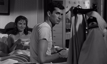 Movie still from “On the Beach” (1959), directed by Stanley Kramer – A man and a woman in a room; Medium shot, Over the shoulder angle