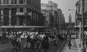 Movie still from “On the Beach” (1959), directed by Stanley Kramer – A black - and - white photo of a busy city street; Extreme Wide shot, High angle