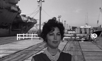 Movie still from “On the Beach” (1959), directed by Stanley Kramer – A black - and - white photo of a woman in a black dress; Close Up shot, Low angle