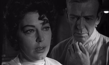 Movie still from “On the Beach” (1959), directed by Stanley Kramer – An older man and a younger woman looking at each other; Close Up shot, Over the shoulder angle