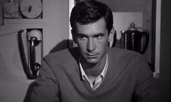 Movie still from “On the Beach” (1959), directed by Stanley Kramer – Black and white photograph of a man in a sweater; Close Up shot, High angle