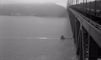 Movie still from “On the Beach” (1959), directed by Stanley Kramer – A black and white photo of a boat on the water; Extreme Wide shot, High angle