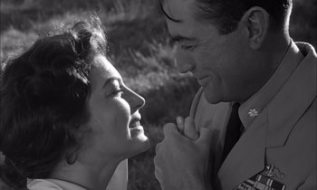 Movie still from “On the Beach” (1959), directed by Stanley Kramer – A man and a woman looking into each others eyes; Close Up shot, Low angle
