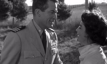 Movie still from “On the Beach” (1959), directed by Stanley Kramer – A man and a woman talking to each other; Close Up shot, Over the shoulder angle