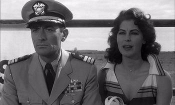 Movie still from “On the Beach” (1959), directed by Stanley Kramer – A man and a woman are standing next to each other; Close Up shot, Low angle