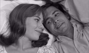 Movie still from “On the Beach” (1959), directed by Stanley Kramer – A man and a woman laying in bed together; Close Up shot, High angle