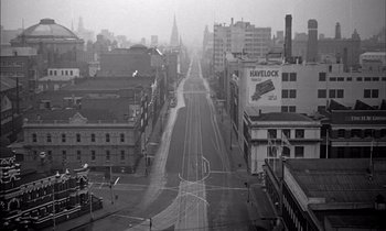 Movie still from “On the Beach” (1959), directed by Stanley Kramer – An empty city street in the middle of the day; Extreme Wide shot, High angle