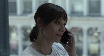Movie still from “On the Rocks” (2020), directed by Sofia Coppola – A woman talking on a cell phone while sitting down; Close Up shot, Over the shoulder angle