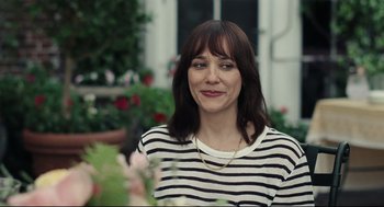 Movie still from “On the Rocks” (2020), directed by Sofia Coppola – A person wearing a striped shirt; Close Up shot, Over the shoulder angle