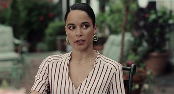 Movie still from “On the Rocks” (2020), directed by Sofia Coppola – A woman sitting on top of a wooden bench; Close Up shot, Over the shoulder angle