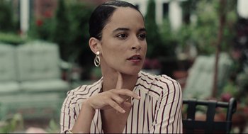 Movie still from “On the Rocks” (2020), directed by Sofia Coppola – A woman in a white and red striped shirt; Close Up shot, Over the shoulder angle