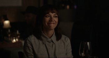 Movie still from “On the Rocks” (2020), directed by Sofia Coppola – A woman sitting at a table with a glass of wine; Close Up shot, Over the shoulder angle
