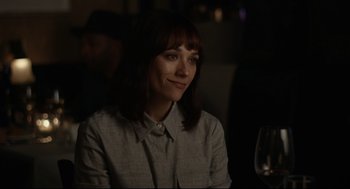 Movie still from “On the Rocks” (2020), directed by Sofia Coppola – A woman sitting at a table with a glass of wine in front of her; Close Up shot, Over the shoulder angle