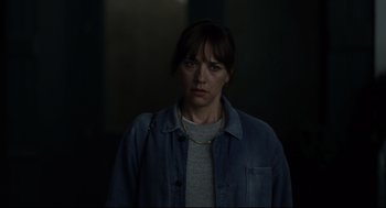 Movie still from “On the Rocks” (2020), directed by Sofia Coppola – A woman in a gray shirt and a blue jean jacket; Close Up shot, Over the shoulder angle