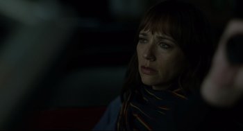 Movie still from “On the Rocks” (2020), directed by Sofia Coppola – A person wearing a scarf; Close Up shot, Over the shoulder angle