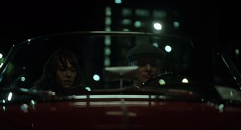 Movie still from “On the Rocks” (2020), directed by Sofia Coppola – A man and a woman in a car at night; Close Up shot, Over the shoulder angle