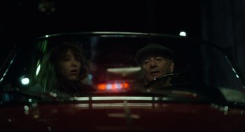 Movie still from “On the Rocks” (2020), directed by Sofia Coppola – A man and a woman sitting in the back seat of a car; Close Up shot, Low angle