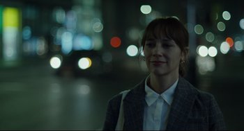 Movie still from “On the Rocks” (2020), directed by Sofia Coppola – A woman standing in the middle of a street; Close Up shot, Over the shoulder angle