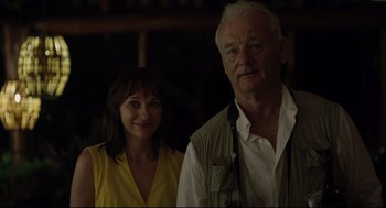 Movie still from “On the Rocks” (2020), directed by Sofia Coppola – A man and a woman standing next to each other; Close Up shot, Over the shoulder angle