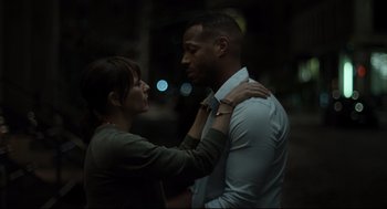Movie still from “On the Rocks” (2020), directed by Sofia Coppola – A man and a woman standing next to each other; Medium shot, Over the shoulder angle