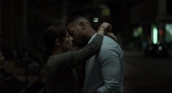Movie still from “On the Rocks” (2020), directed by Sofia Coppola – A man and a woman standing next to each other; Medium shot, Over the shoulder angle
