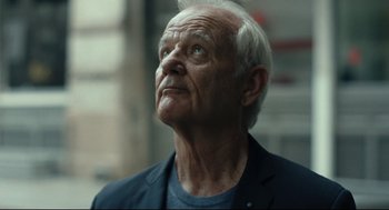 Movie still from “On the Rocks” (2020), directed by Sofia Coppola – An older man looking up into the sky; Close Up shot, Low angle
