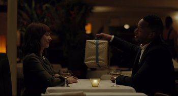 Movie still from “On the Rocks” (2020), directed by Sofia Coppola – A man and a woman sitting at a dinner table; Medium shot, Over the shoulder angle