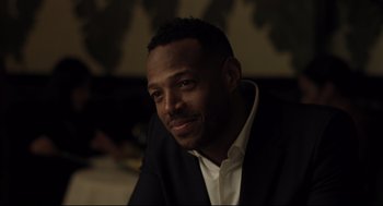 Movie still from “On the Rocks” (2020), directed by Sofia Coppola – A person wearing a suit and tie; Close Up shot, Over the shoulder angle