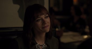 Movie still from “On the Rocks” (2020), directed by Sofia Coppola – A person smiling at the camera; Close Up shot, Over the shoulder angle