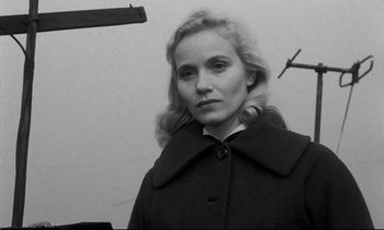 Movie still from “On the Waterfront” (1954), directed by Elia Kazan – Black and white photograph of a woman in a coat; Close Up shot, Low angle