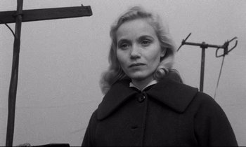 Movie still from “On the Waterfront” (1954), directed by Elia Kazan – Black and white photograph of a woman in a coat; Close Up shot, Low angle