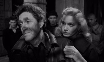Movie still from “On the Waterfront” (1954), directed by Elia Kazan – A black and white photo of a man and a woman; Close Up shot, Over the shoulder angle