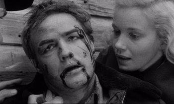 Movie still from “On the Waterfront” (1954), directed by Elia Kazan – A man and a woman with blood on his face; Close Up shot, Low angle