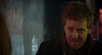 Movie still from “Once” (2007), directed by John Carney – A person with food on his face; Close Up shot, Over the shoulder angle